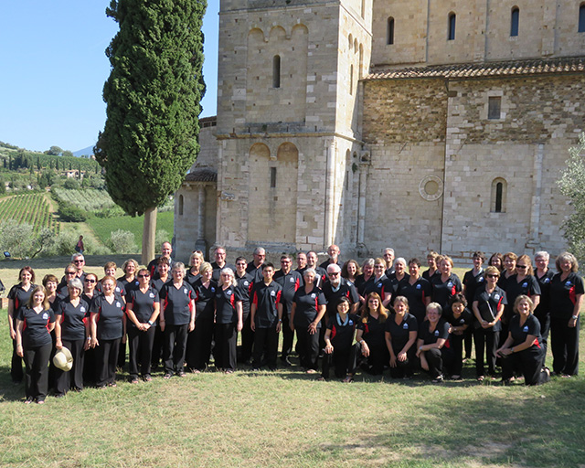photo of choir in front of Abbazia di Sant'Antimo, Italy